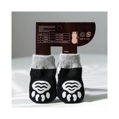 China Adorable Pet Dog Socks with Cartoon Pattern and Breathable Black Terry Knitted Design for sale