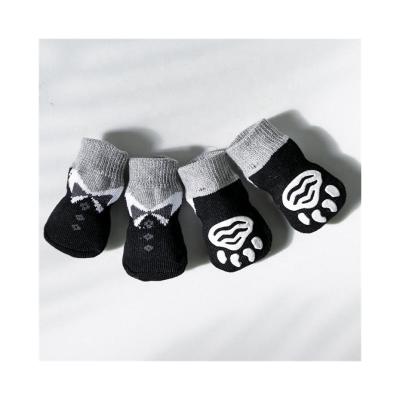 China Black Pet Shoe Socks For Dogs High Qualilty Protection Comfort Foot Glue Animal Ear Socks for sale