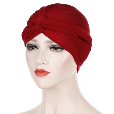 China Daily Life Solid Color Hijab Slouchy Hat Arab Indian Crossed Muslim Women Turban Hat for sale