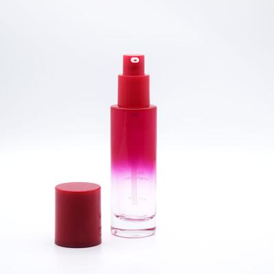 China PERSONAL CARE Red Color 30ml Glass Bottle With Treatment Pump For Base for sale