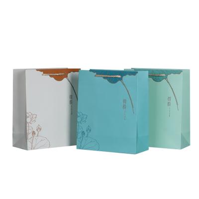 China Recyclable Luxury Ribbon Handle Boutique Shopping Packaging Customized Printed Paper Gift Bag With Logo for sale