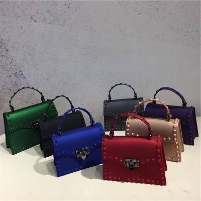 China Lady (1.0) 1223 new fashion frosted rivet matte fashionable portable one-shoulder diamond color jelly bag diagonal pvc bag for sale