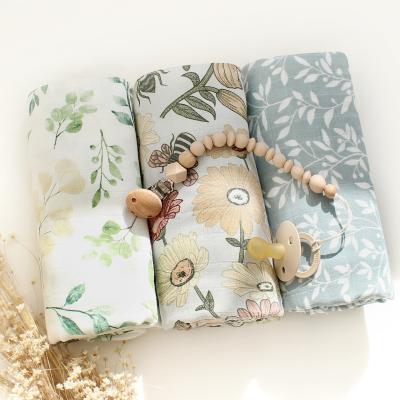 China 2022 New Design 120x120cm PORTABLE Baby Wrap Set Soft Newborn Eucalyptus Leave Printed Cotton Organic Bamboo Muslin Wrap for sale