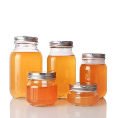 China Food Most Popular Products 380ml 420ml 730ml Around Honey Can Containers With Glass Labels for sale