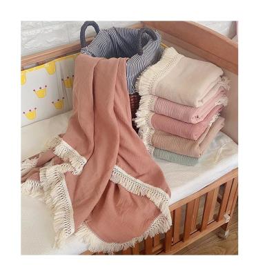 China Soft Creative Design Gauze Summer Cool Quilt Tassel Solid Color Knit Baby Blanket for sale