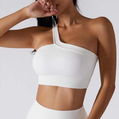 China Breathable Custom Logo Ribbed Padded Inserts White One Shoulder Sports Bra for sale