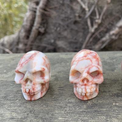 China Red Vein Mini Skulls Mini Crystal Skulls Healing Carved Crystal Decorative Skulls Wholesale From China For Gift for sale