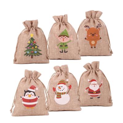 China Factory Wholesale Eco-Friendly Logo Snowman Pattern Festival Gift Jute Pouch Christmas Jute Bags Custom Made With Logo Te koop