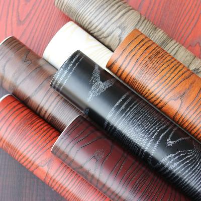 China Door embossed door sticker waterproof wood grain wallpapers vinyl wood texture brown furniture thickened door embossed sticker for sale