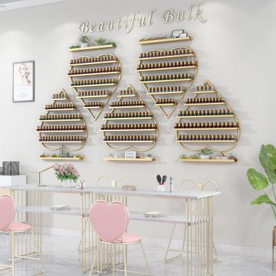 China Displaying Goods Salon Furniture Wrought Iron Heart-shaped Manicure Shelf Wall Hanging Nano Gold Wall Rack Nail Polish Display Stand for sale