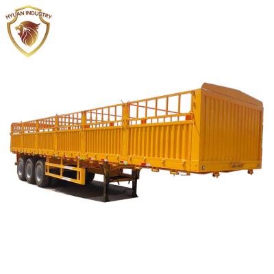 China Truck Trailer HYUAN 3 Axles 50 60 Ton Sidewall Cargo Sideboard Multifunctional Wall Stake Animal Barrier Dropside Grain Transport Semi Trailer for sale