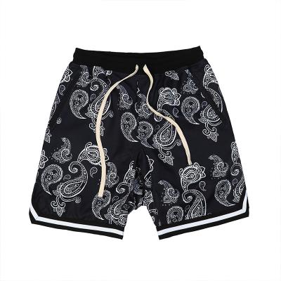 China Anti-wrinkle wholesale 70s plus size bandana african beach shorts casual mens paisley print panel black shorts for men for sale