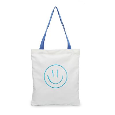 China Other Hot Luxury Custom Smiley Face Pattern New Product Sale White Casual Large Capacity Canvas Book Tote Bag for sale