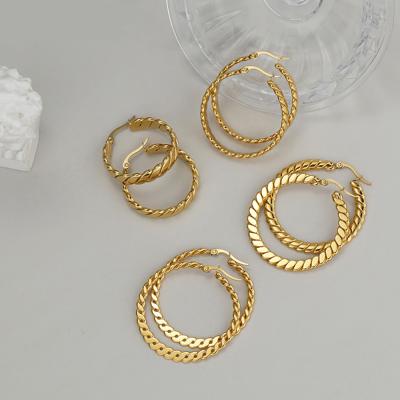 China Minimalist gold plated circle earring E0945 titanium steel wholesale minimalist gold plated huggie twisted earring for women big circle geometric titanium steel earrings for sale