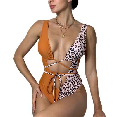 China Custom Plus Size Patchwork RTS Swimsuit Leopard Printed Crisscross Splice Onesie Tie Back Women's Beachwear Bikini Swimwear Swimwear for sale