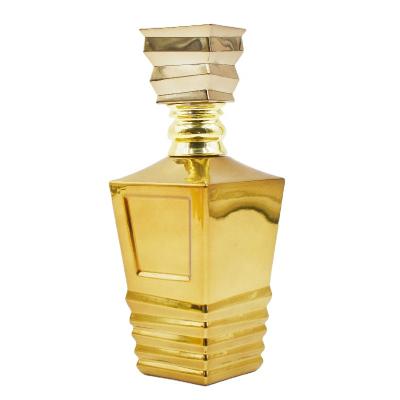 China Unique Personal Care Dubai Perfume Bottle Fancy 100ml Perfume Bottle Black Gold Glass Perfume Bottle With Packaging for sale