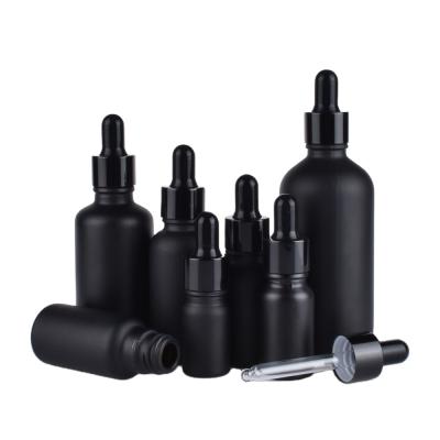 China Matte Black White Essential Oil Personal Care Bottles Round Dropper Essential Oil Glass Bottle for sale