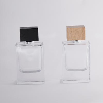 China Personal Care 50ml Perfume Packaging Square Glass Perfume Cologne Bottle With Wooden Lids for sale