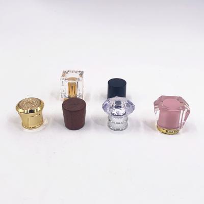 China Luxury Customized Shaped Plastic Perfume Cap Heavy Perfume Cap For 15mm Perfume Bottle for sale