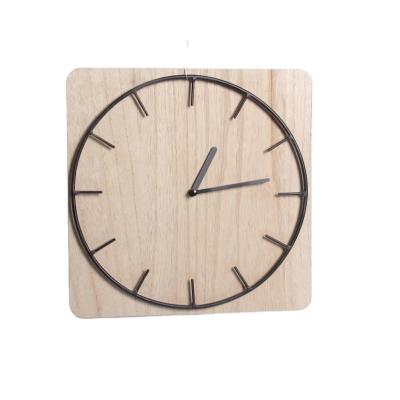 China Class Modern Classic Metal Round Shaped Home Decorative Creative Clock With Natural Wood Base for sale