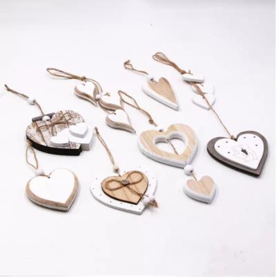 China DIY Modern Center Hollow Heart Opens Wedding Wooden Pendant Valentine's Day Party Design Heart Ornament Christmas Tree Hanging Decor for sale