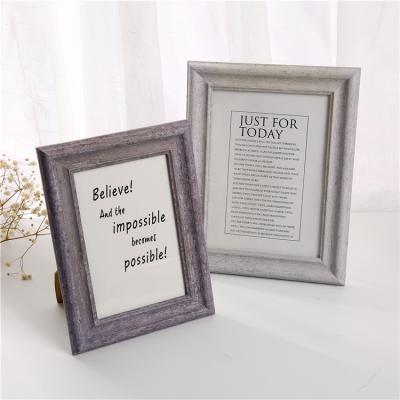 China Creative white plastic picture frame small picture frame home decoration home decoration desktop photo view wall picture combination for sale