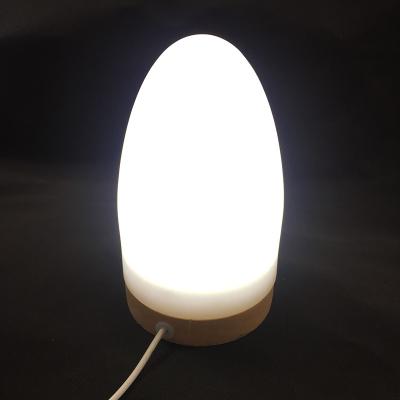 China Eco-friendly Wooden Egg Shaped Light Color Bedside Bedroom Kids Table Lamp USB Decorative Table Lamp At Night for sale