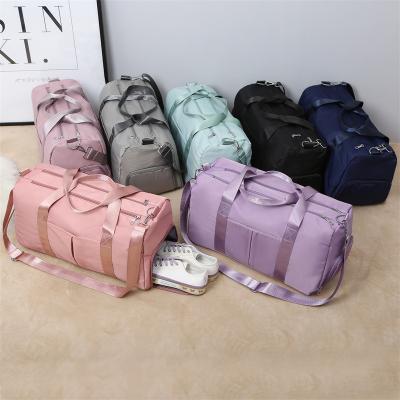 China Wholesale High Capacity Multi-size Waterproof Laptop Bag Sports Travel Pink Duffel Bags Waterproof Workout Polyester Gym Bag Custom Women for sale