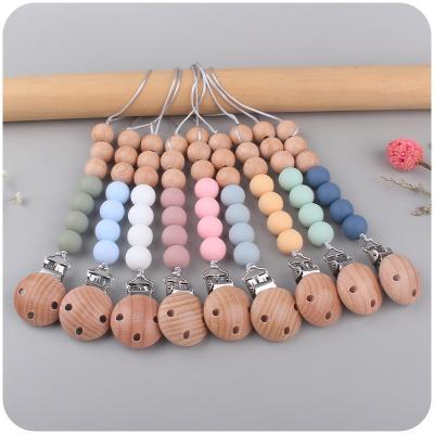 China Wholesale Food Grade BPA Free Baby Teething Non-Toxic Chupetes BPA Free Silicone With Wooden Beads Soother Clip Nipple Pacifier for sale