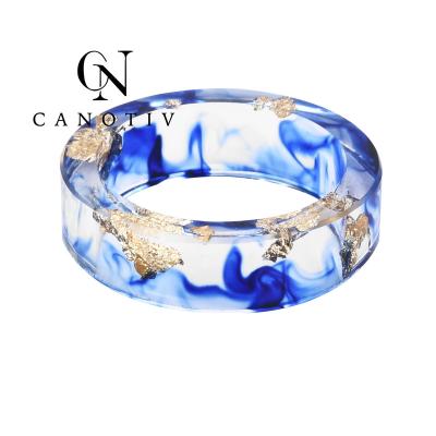 China Fashion Hot Sale Beautiful Wedding Rings For Women Blue Sapphire Resin Ring Spinning Dry Flower Rings New Design for sale