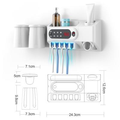 Cina Hot selling rechargeable wireless wall mounted multifunction Toothbrush Sanitizer Holder in vendita