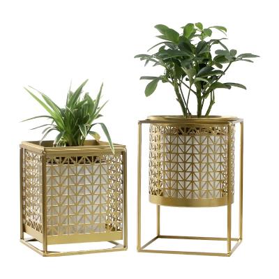 China Modern creative balcony garden decorative metal flower pots and indoor planters and outdoor use gold metal stand greenish planter for sale