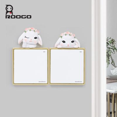 China Art Decor ROOGO Cute Cartoon Garden Rabbit Switch Stickers Kids Bedroom And Home Living Room Wall Switch Stickers for sale