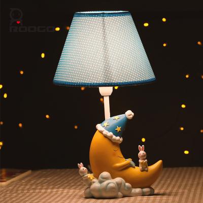 China Art Decor ROOGO Decorative Cartoon Character Table Moon Shaped Lamp For Kids Bedroom for sale