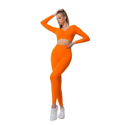 China New Arrival Breathable Sports Yoga Set For Women 2 Pcs Pure Color Quick Drying Equipment Pants Long Sleeve Clothes Yoga Sport Sets for sale