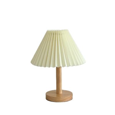 China Direct selling modern bedroom manufacturer simple table lamp creative Korean warm romantic led small bedside pleated decorative La for sale