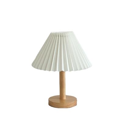 China Direct selling modern creative bedroom manufacturers simple table lamp Korean warm romantic led small pleated decorative night l for sale