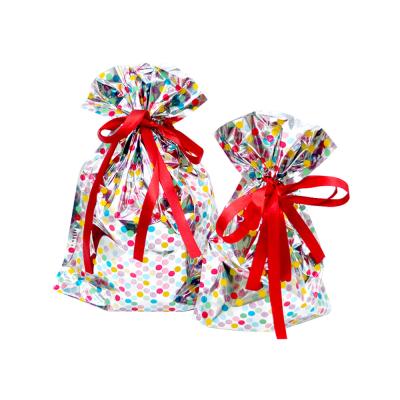 China OPP+VMPET+PE Plastic Merry Christmas Candy Drawstring Gift Bags for sale