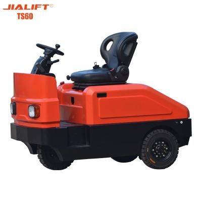 China 6000 kg Tractor eléctrico de remolque Motores con asiento Equipaje eléctrico remolcador 5500N en venta