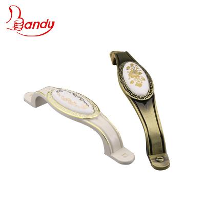 China Quality Traditional Oval Zamak Ceramic Zinc Alloy Flower Pattern And Color Customized Sideboard Cupboard Wardrobe Pull Handles for sale