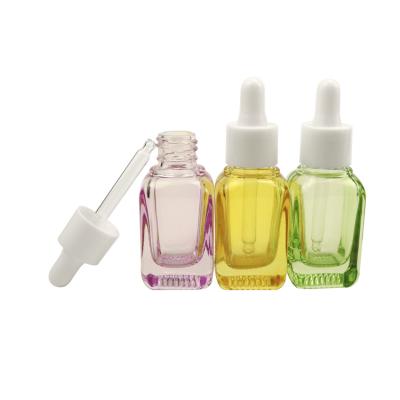 China Fashion cosmetic design 30ml black glass cosmetic serum dropper bottle/pink /green square for sale