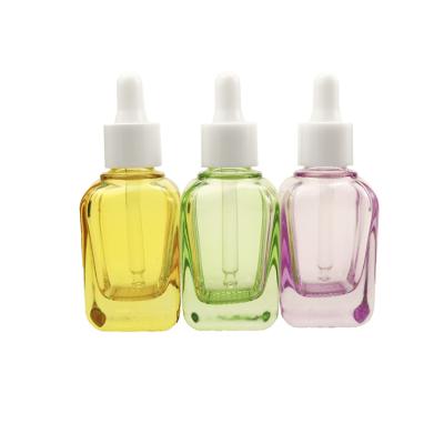 China Customized color 15ml 30ml 50ml 100ml clear square rectangle glass bottle cosmetic essential oil bottle with dropper cap for sale