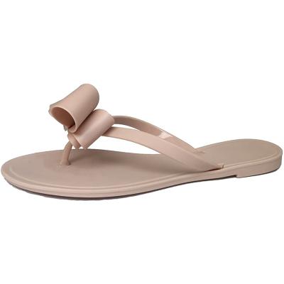 China CUSHIONING Women Flip Flops Pearl Bow Sandals Beach Flat Rivets Rain Jelly Gold Pearls for sale