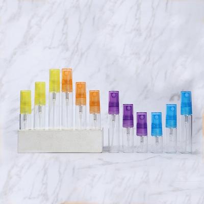 China 2ml 3ml 5ml Mini Cosmetic Transparent Glass Vial For Perfume Sample Vial With Colorful Spray Pump for sale