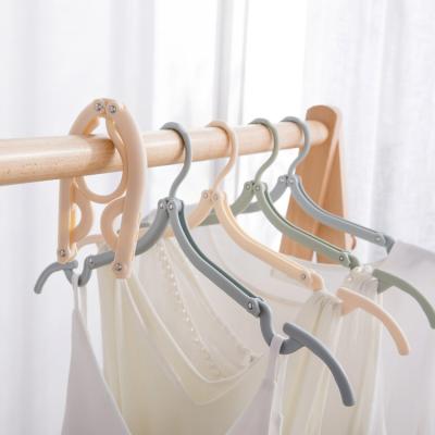 China 8 Pcs Multifunctional Space Saver Modern Anti-Slip Hangers For Clothes Storage Hanger Travel Hanging Folding Plastic Hanger for sale