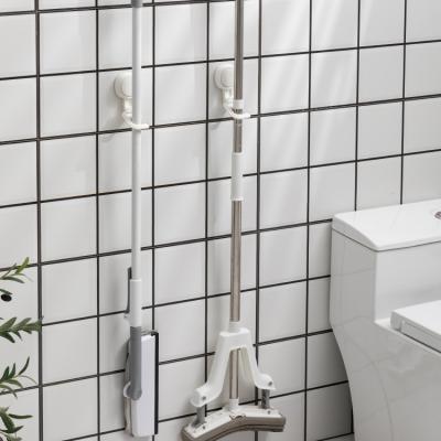 China Fashionable Taili No Vacuum Sucker Hook Drill Broom Stretch Strong Wall Mounted Hanging Hook For Toilet Bathroom for sale