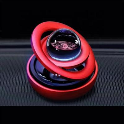 China Solar Energy Amazon Car Scent Solar Air Freshener Dual Rotation Automatic Ring Suspension Essential Oil Diffuser Aromatherapy for sale