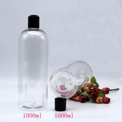 China 1000ml household products PET plastic round shoulder spray bottle clear household hand sanitizer bottle made in China for sale