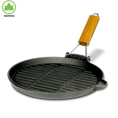 China Sustainable Round Cast Iron Grill Pan With Bent Wooden Handle for sale