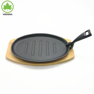 China Sustainable cast iron hot day pan with wood with fork for sale